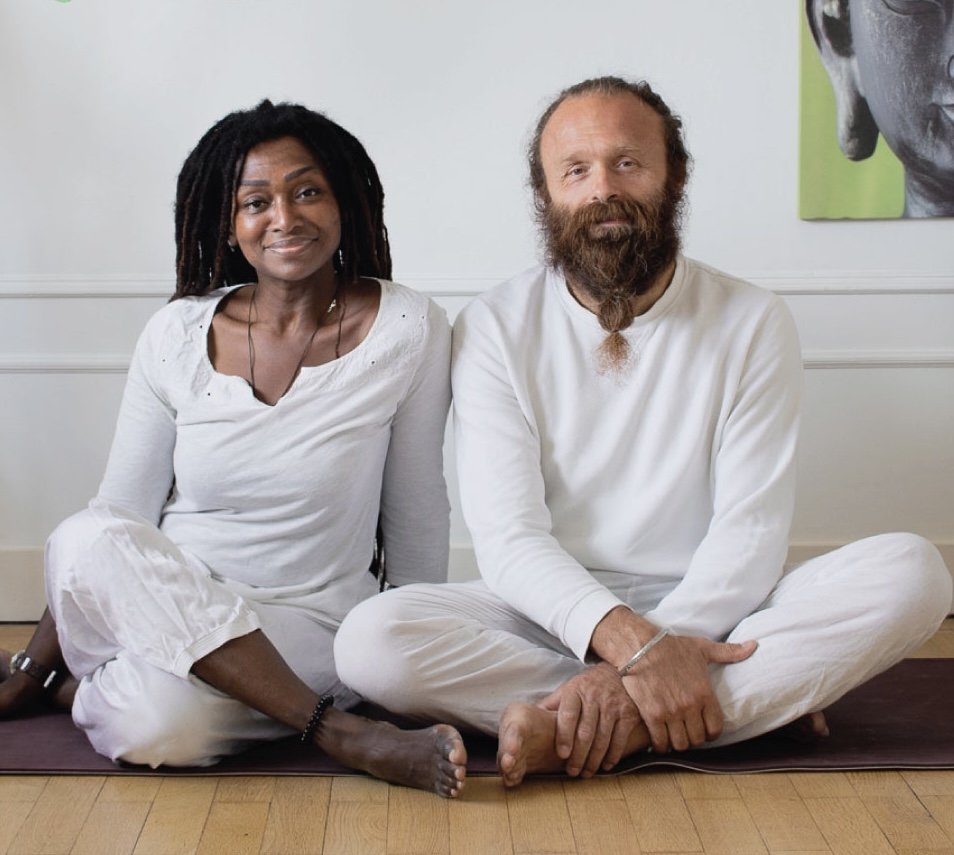 two yoga teachers sitting in front of the class