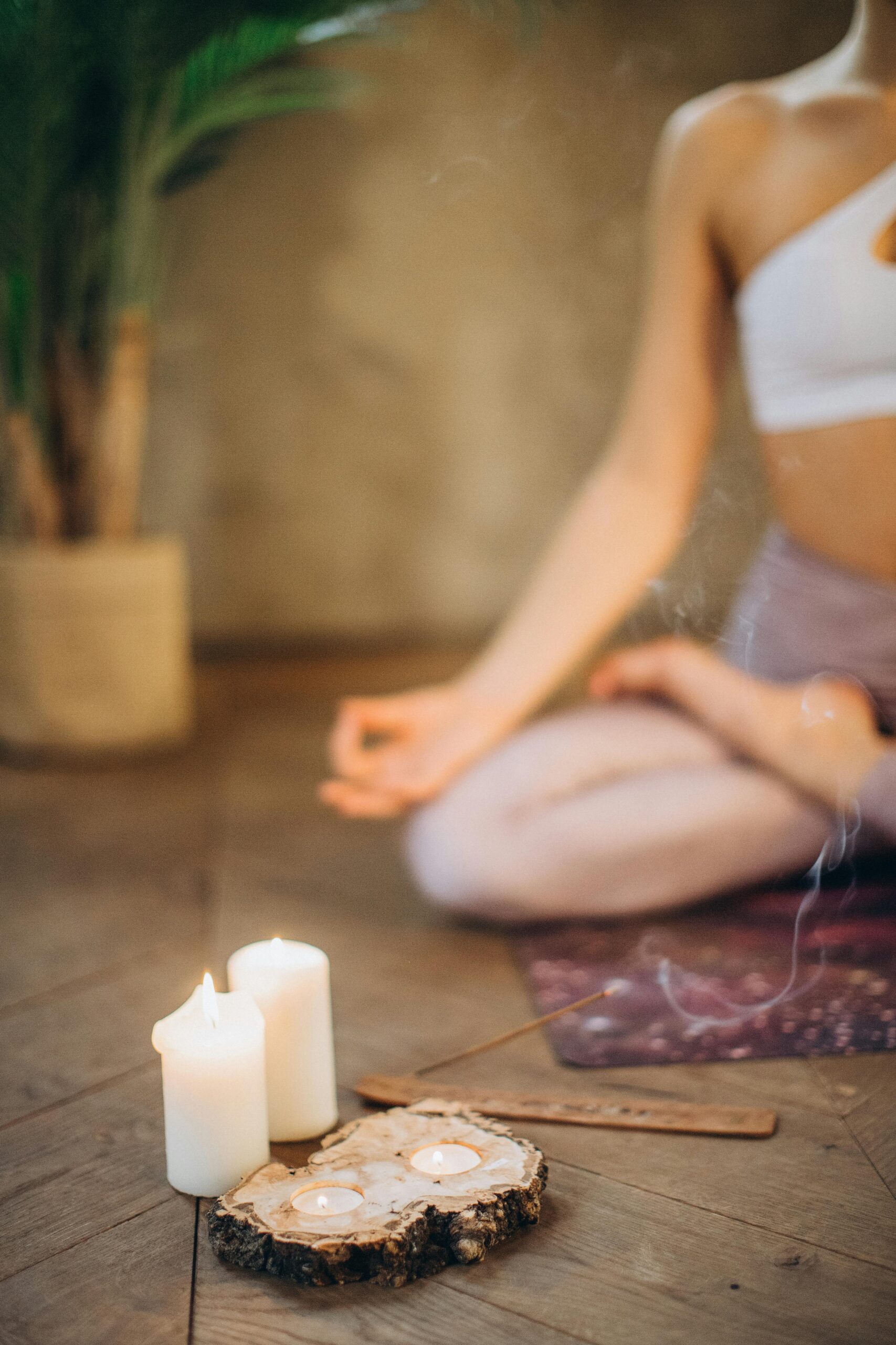 Woman in a yoga lotus pose at the jewel within sacred healing session